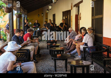 Cuba, Trinidad, Band playing to Tourists at Bar La Canchanchara -  - famous for its house cocktail made from rum, honey, lemon and water served in an earthenware bowl Stock Photo