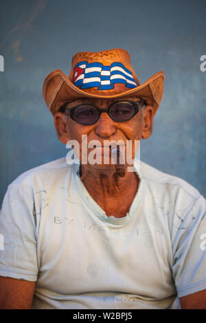 Cuba, Trinidad, Elderly Cuban man smoking cuban cigar
