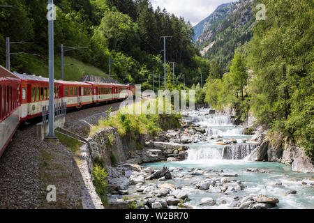 Glacier Express train climbing towards Zermatt, Valais, Switzerland Stock Photo