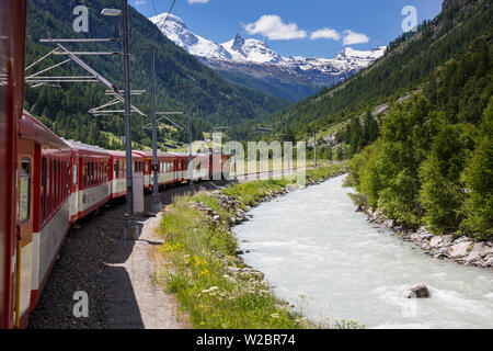 Glacier Express train climbing towards Zermatt, Valais, Switzerland Stock Photo