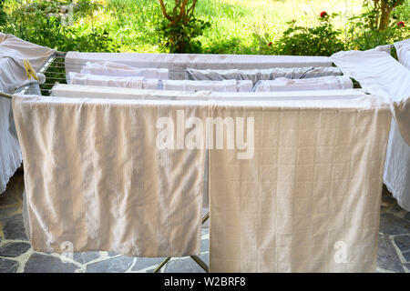 Laundry Drying on a Clothes Rack Stock Photo