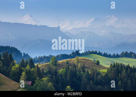 Emmental Valley and Swiss alps in the background, Berner Oberland, Switzerland Stock Photo