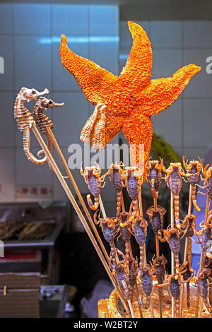 China, Beijing, Scorpians and Starfish on skewers for sale in Wangfujing street night market Stock Photo