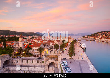 Elevated view over Trogir's Stari Grad (Old Town) illuminated at sunset, Trogir, Dalmatia, Croatia Stock Photo