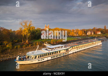 Germany, Rheinland-Pfalz, Speyer, Dom cathedral from Rhein River with cruiseboat, sunrise Stock Photo