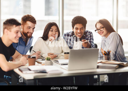 Learning together. Students doing group study in library Stock Photo