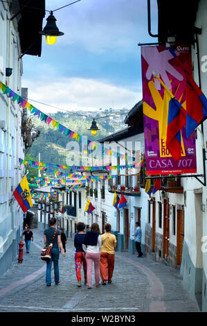 Tourists Stroll Along Calle La Ronda, One of The Oldest Streets In Quito, Mix of Restaurants and Houses, Quito, Ecuador Stock Photo