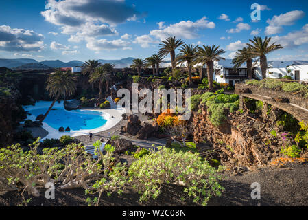 Spain, Canary Islands, Lanzarote, Jameos del Agua, complex inside old lava tube, designed by Cesar Manrique, exterior pool Stock Photo