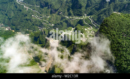 (190708) -- BEIJING, July 8, 2019 (Xinhua) -- Aerial photo taken on May 31, 2019 shows a view of the Tianmen Mountain Scenic Area in Zhangjiajie, central China's Hunan Province. Located in central China, Hunan Province is well-known for its varied topography. It abuts the Dongting Lake to the north, and the east, south and west sides of the province are surrounded by mountains, with Wuling and Xuefeng Mountains to the west, Nanling Mountain to the south, Luoxiao and Mufu Mountains to the east. The Xiangjiang, Zijiang, Yuanjiang and Lishui Rivers converge on the Yangtze River at the Dongting La Stock Photo