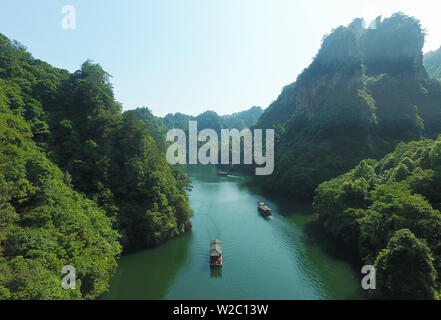 (190708) -- BEIJING, July 8, 2019 (Xinhua) -- Aerial photo taken on June 1, 2019 shows a view of the Baofeng Lake in the Wulingyuan Scenic Area in Zhangjiajie, central China's Hunan Province. Located in central China, Hunan Province is well-known for its varied topography. It abuts the Dongting Lake to the north, and the east, south and west sides of the province are surrounded by mountains, with Wuling and Xuefeng Mountains to the west, Nanling Mountain to the south, Luoxiao and Mufu Mountains to the east. The Xiangjiang, Zijiang, Yuanjiang and Lishui Rivers converge on the Yangtze River at t Stock Photo