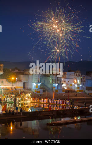 India, Rajasthan, Pushkar, Fireworks at  lakeside ceremony during Pushkar Camel Fair Stock Photo