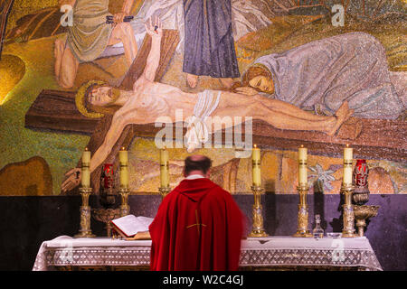 Israel, Jerusalem, Church of the Holy Sepulchre, Calvary (or Golgotha), featuring a mosaic of Jesus - the place where Jesus was crucified - which is Station 11 on the Via Dolorosa Stock Photo