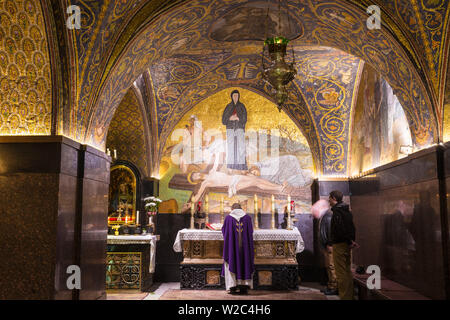 Israel, Jerusalem, Church of the Holy Sepulchre, Calvary (or Golgotha), featuring a mosaic of Jesus - the place where Jesus was crucified - which is Station 11 on the Via Dolorosa Stock Photo