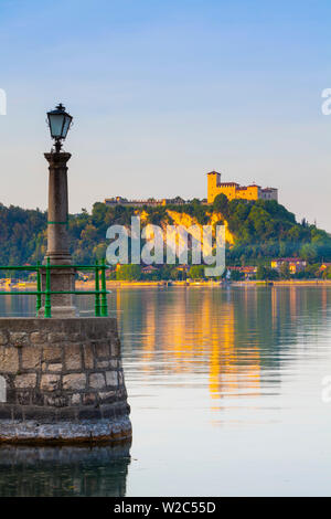 The imposing La Rocca fortress viewd from Arona at sunset, Lake Maggiore, Piedmont, Italy Stock Photo