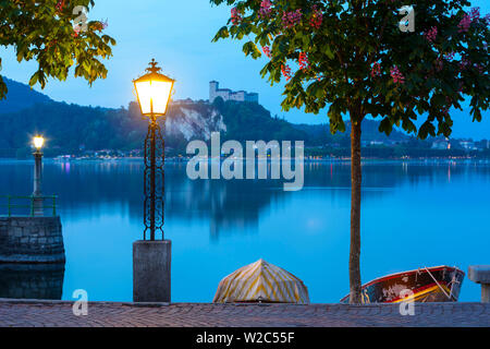 La Rocca fortress viewed from Arona at dusk, Lake Maggiore, Piedmont, Italy Stock Photo