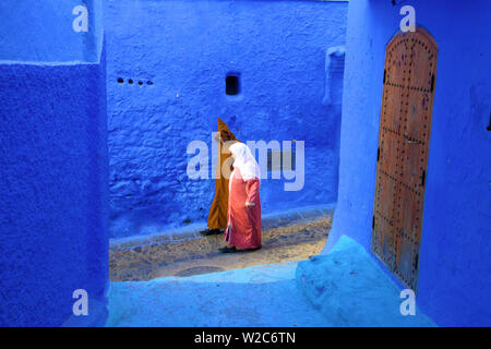 People In Traditional Clothing, Chefchaouen, Morocco, North Africa Stock Photo