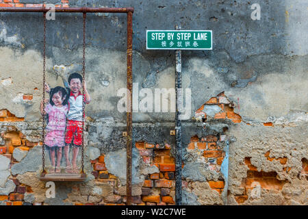 Malaysia, Penang, Georgetown,  Chulia Street Ghaut (Lebuh Chulia), Brother and Sister on a Swing Street Art, Step by Step Lane sign part of artwork Stock Photo