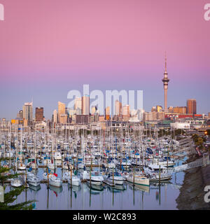Westhaven Marina & city skyline illuminated at dusk, Waitemata Harbour, Auckland, North Island, New Zealand, Australasia Stock Photo