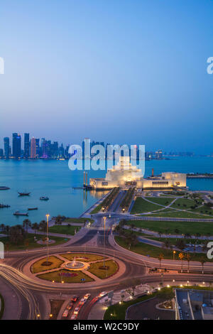 Qatar, Doha, Traffic at roundabout infont of the Museum of Islamic Art at night Stock Photo