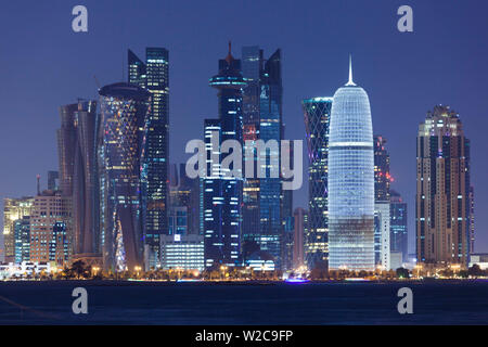 Qatar, Doha, Doha Bay, West Bay skyscrapers, dusk, with Burj Qatar Tower Stock Photo