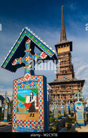 Romania, Maramures Region, Sapanta, The Merry Cemetery with handcarved gravestones with amusing stories about the departed Stock Photo