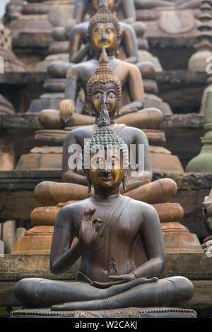 Statues of sitting Buddhas a Gangaramaya temple in Colombo, Sri Lanka Stock Photo