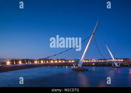 UK, Northern Ireland, County Londonderry, Derry, The Peace Bridge over the River Foyle, 2011, dusk Stock Photo