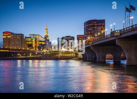 USA, Connecticut, Hartford, city skyline with Connecticut Science Center and Travelers Building, from the Connecticut River, dusk Stock Photo