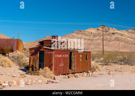 USA, Nevada, Rhyolite ghost town, former train station on Las Vegas and Tonopah Railroad, old rail wagon marked with LA and SL the Los Angeles and Salt Lake Railroad, later part of Union Pacific Railroad Stock Photo