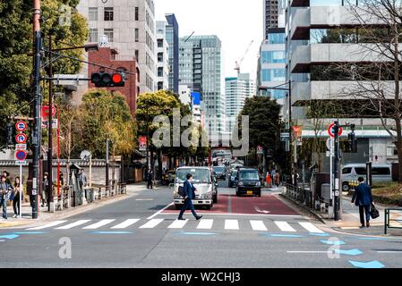 Street scene, pedestrians on zebra crossings, skyscrapers in downtown, city center, Tokyo, Japan Stock Photo
