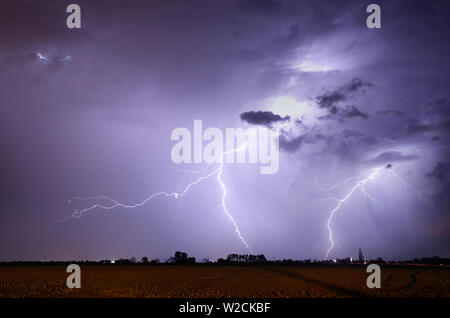 Storm with lightning in landscape Stock Photo