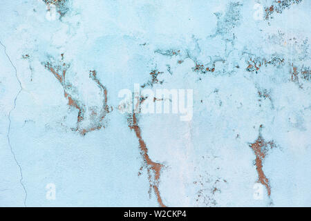 Old pastel blue wall with abrasions. Background with marble effect, copy space, minimal style backdrop. Stock Photo