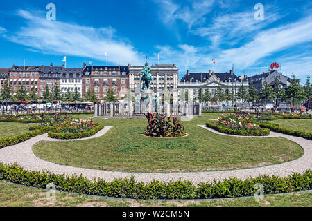 Equestrian statue of Christian V in the centre of Kongens Nytorv Nyhavn Copenhagen Denmark with flower arrangements after Metro station work. Stock Photo