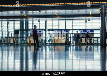 Hamad International Airport, Doha, 2018-05-01: Passengers are checking before boarding the plane. Stock Photo