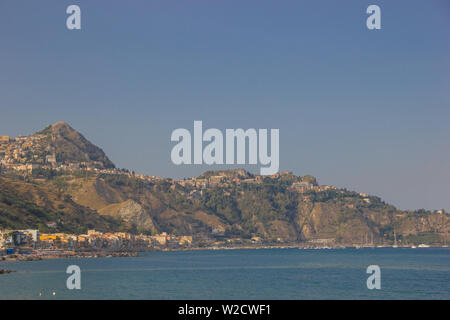 Giardini Naxos Sicily Italy 2019 close up view of the mountains and of famous Taormina on a beautiful blue sea Stock Photo