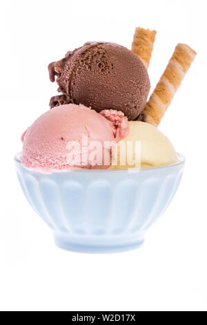 ice cream sundae: Three scoops of ice cream in blue china isolated on white Stock Photo