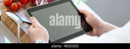 Chef Tablet Showing Organic Vegetable Recipe Stock Photo