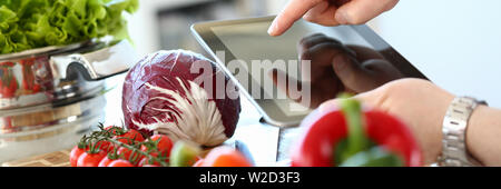 Tablet Showing Vegan Vegetables Salad Recipe Stock Photo