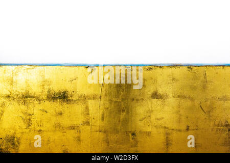 artistic background with canvas painted with gold paint Stock Photo