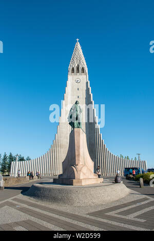 REYKJAVIK, ICELAND - MAY 24, 2019: Tourists visiting the Hallgrimskirkja Lutheran parish church in Reykjavik and the statue of Leif Erikson, the son o Stock Photo