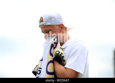 Anton Matusevich during his match against Gauthier Onclin in the boy singles on day seven of the Wimbledon Championships at the All England Lawn Tennis and Croquet Club, Wimbledon. Stock Photo