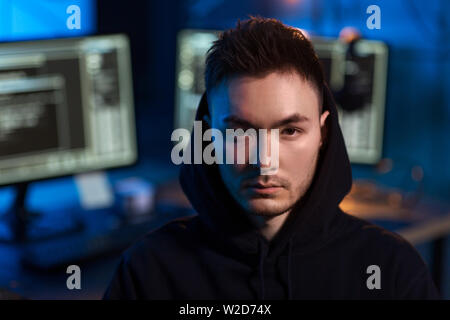 asian hacker in dark room with computers at night Stock Photo