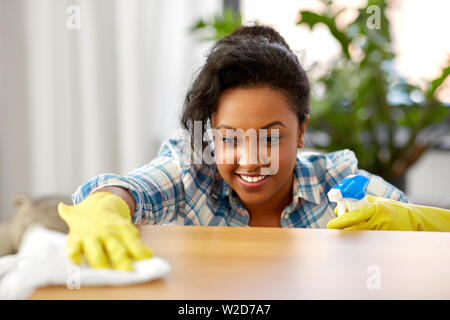 happy woman cleaning table at home kitchen Stock Photo - Alamy