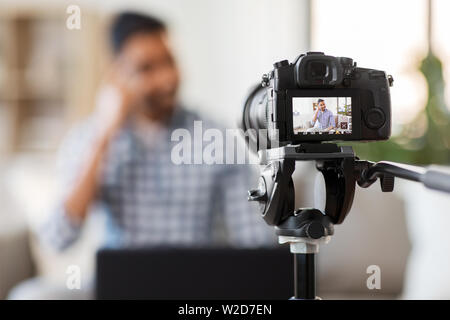 camera recording video blog of indian male blogger Stock Photo