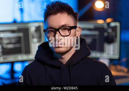 asian hacker in dark room with computers at night Stock Photo