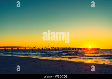 Semaphore Beach  jetty with people at sunset Stock Photo