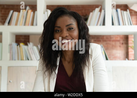 Smiling african business woman coach teacher hr looking at camera Stock Photo