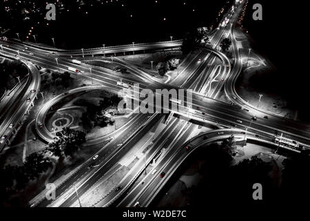 City interchange closeup at night , beautiful transport infrastructure background. Black and White. Aerial view Stock Photo
