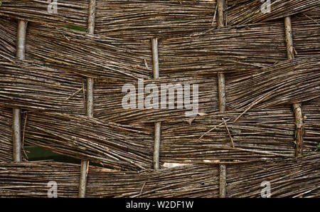 A woven wood fence panel or screen. Stock Photo