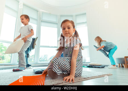 Delighted nice positive girl smiling to you Stock Photo